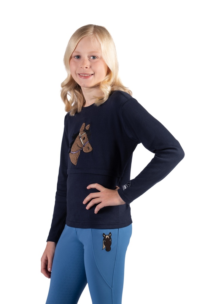 Polo HKM Kids Mia, porté par une jeune cavalière